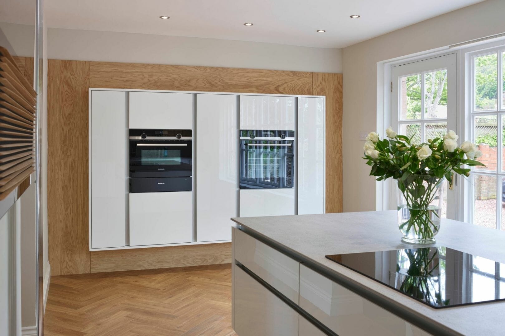White and wooden modern handlesless kitchen White and wooden modern handlesless kitchen
